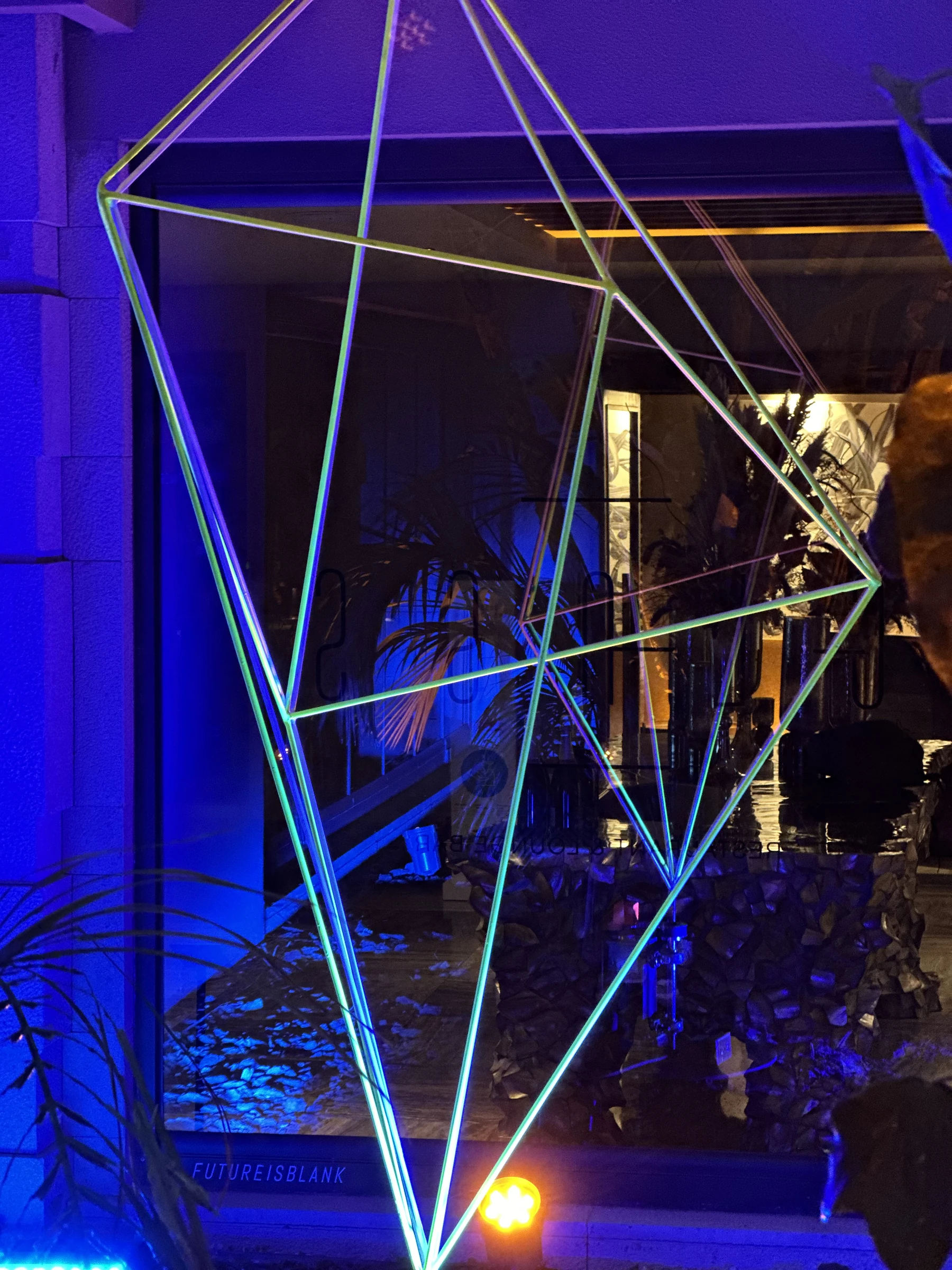 A close view of Geo X’s intersecting fluorescent metal rods