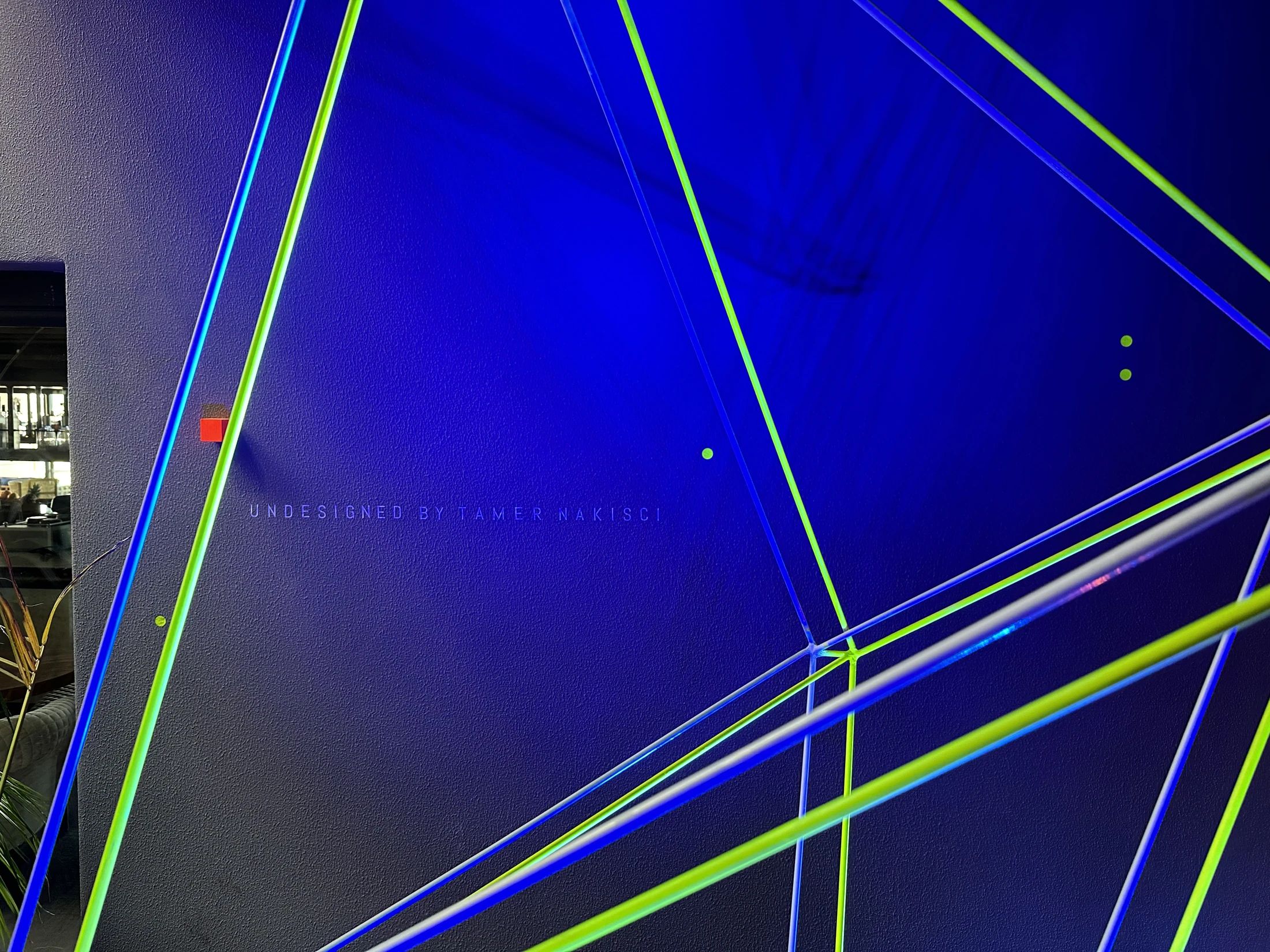 Fluorescent lines crossing against the blue light of the Geo X room