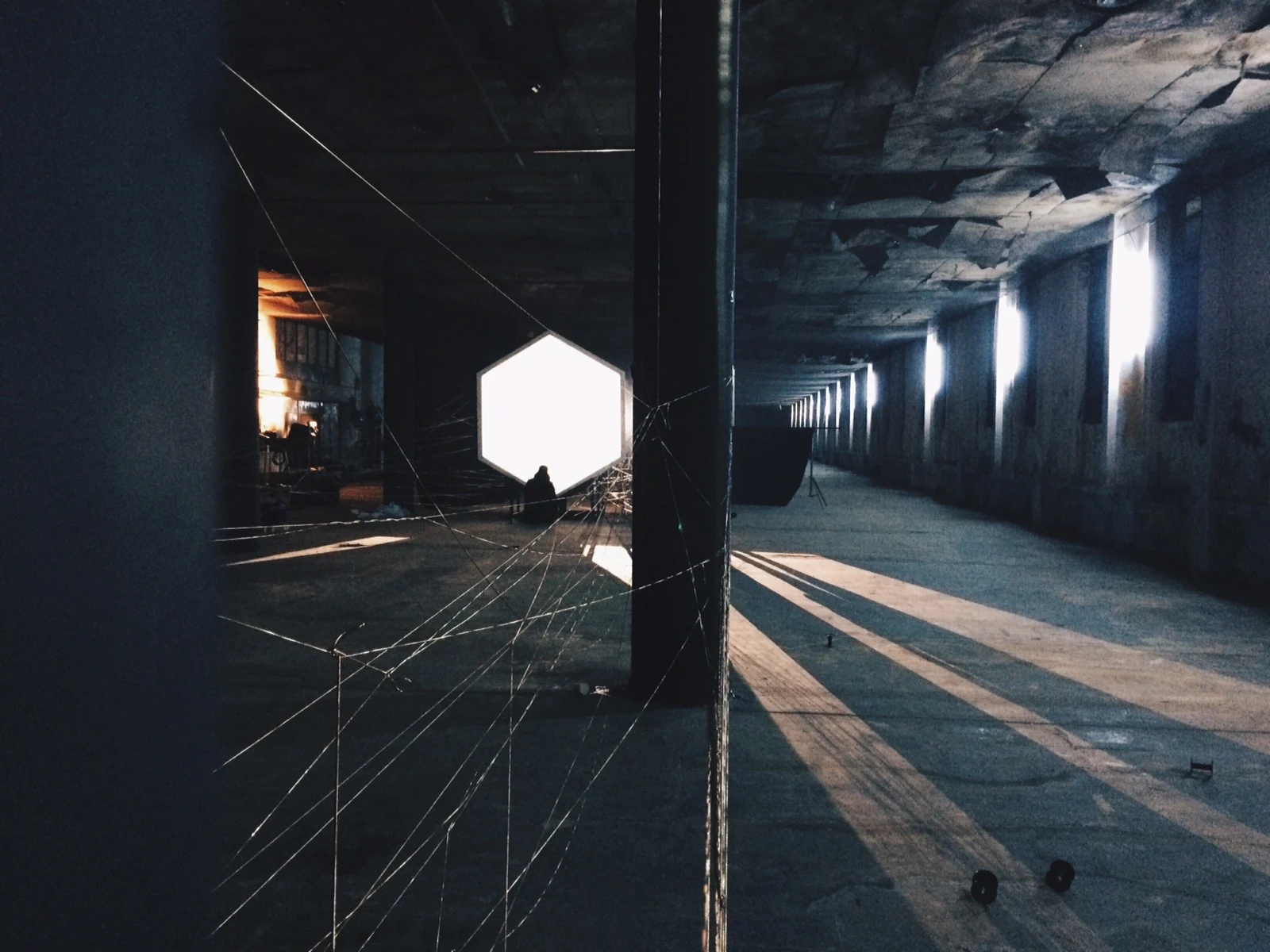 Gateway and long afternoon shadows across the industrial hall