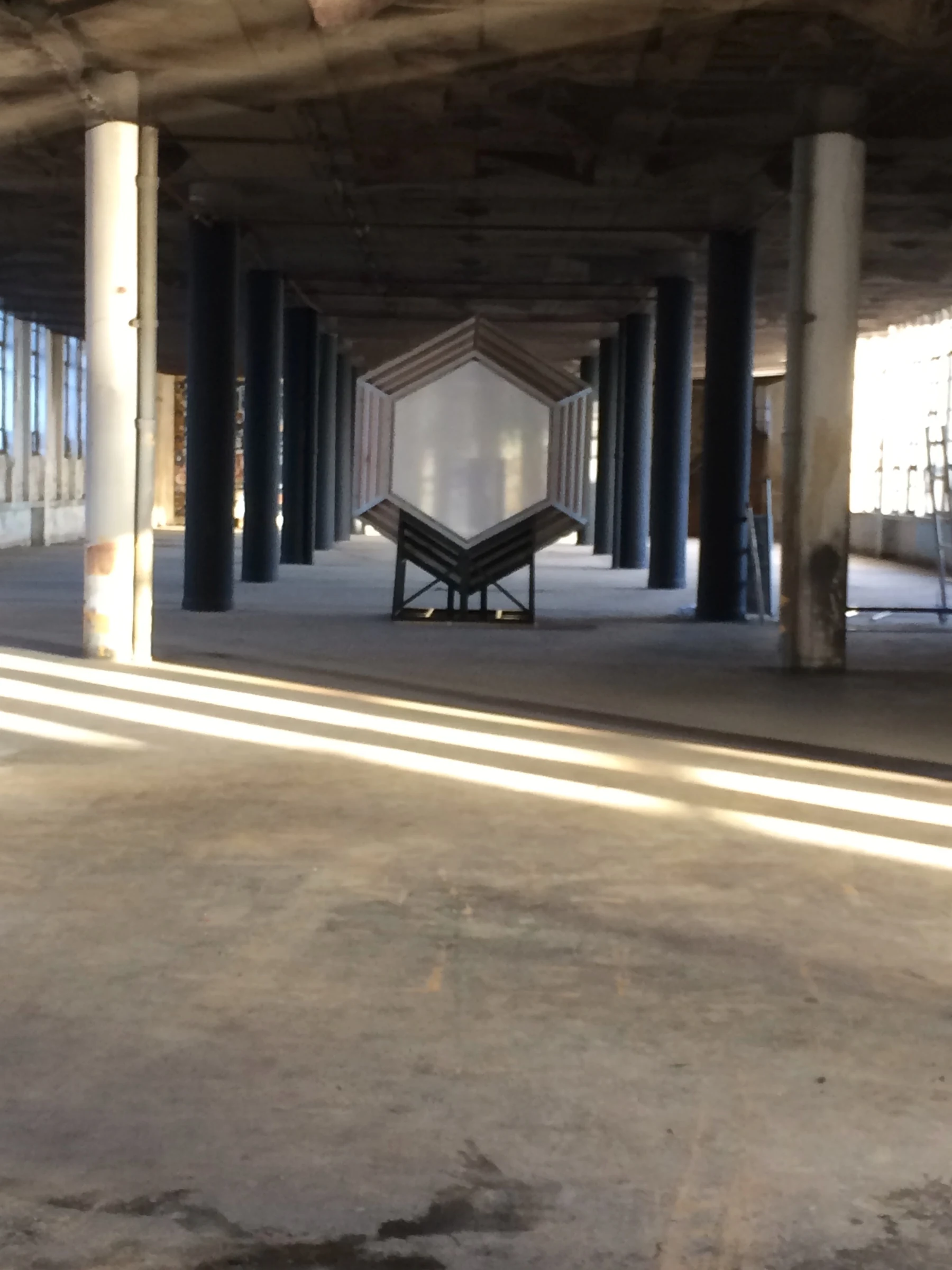 Gateway with mirrored facets, people and changing light