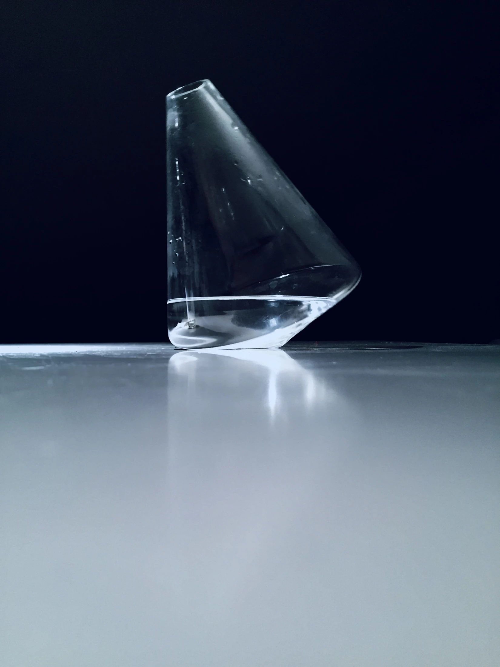 The Omnia water jug against a dark blue background