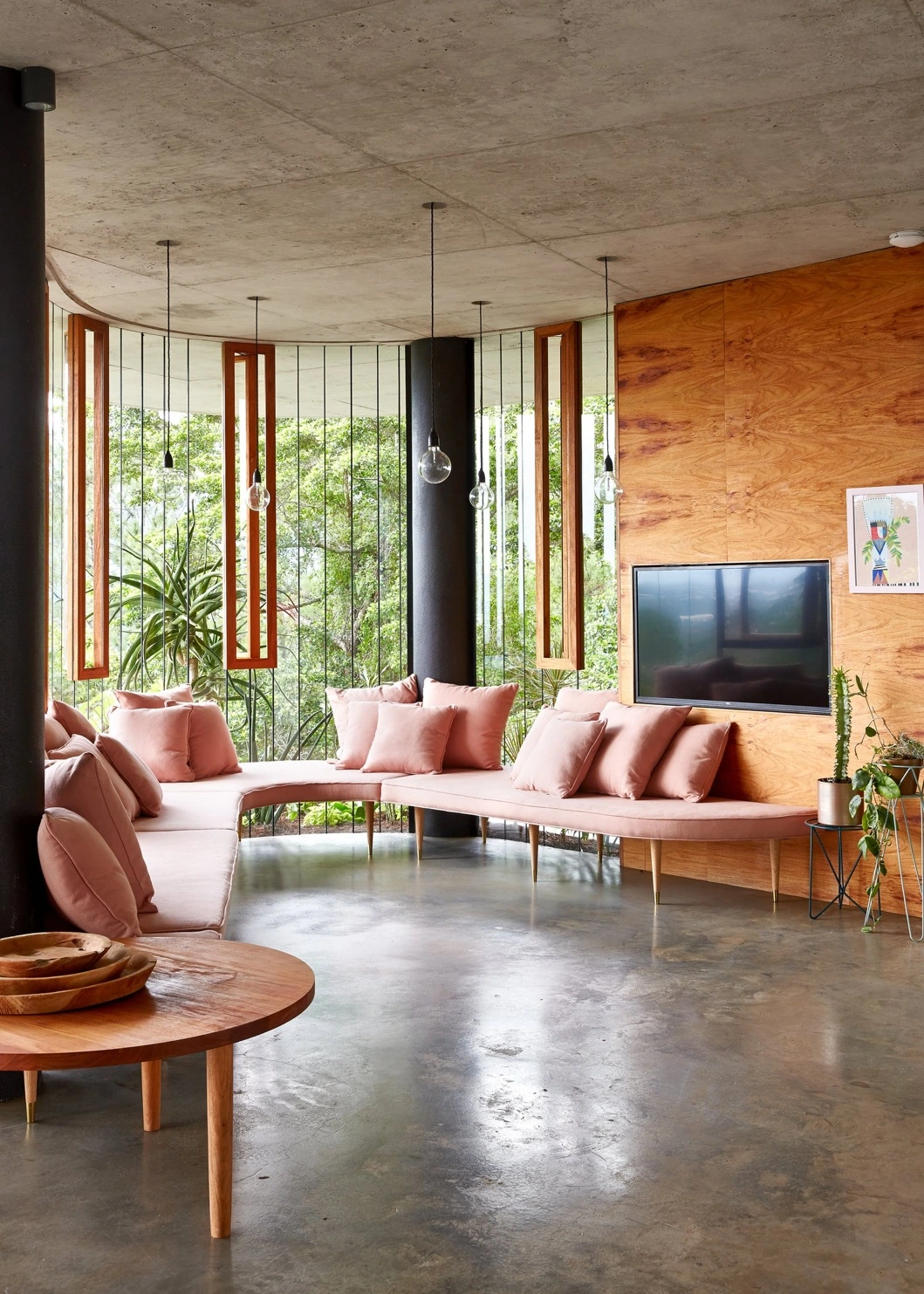 Pink sofa in the living room beside the forest