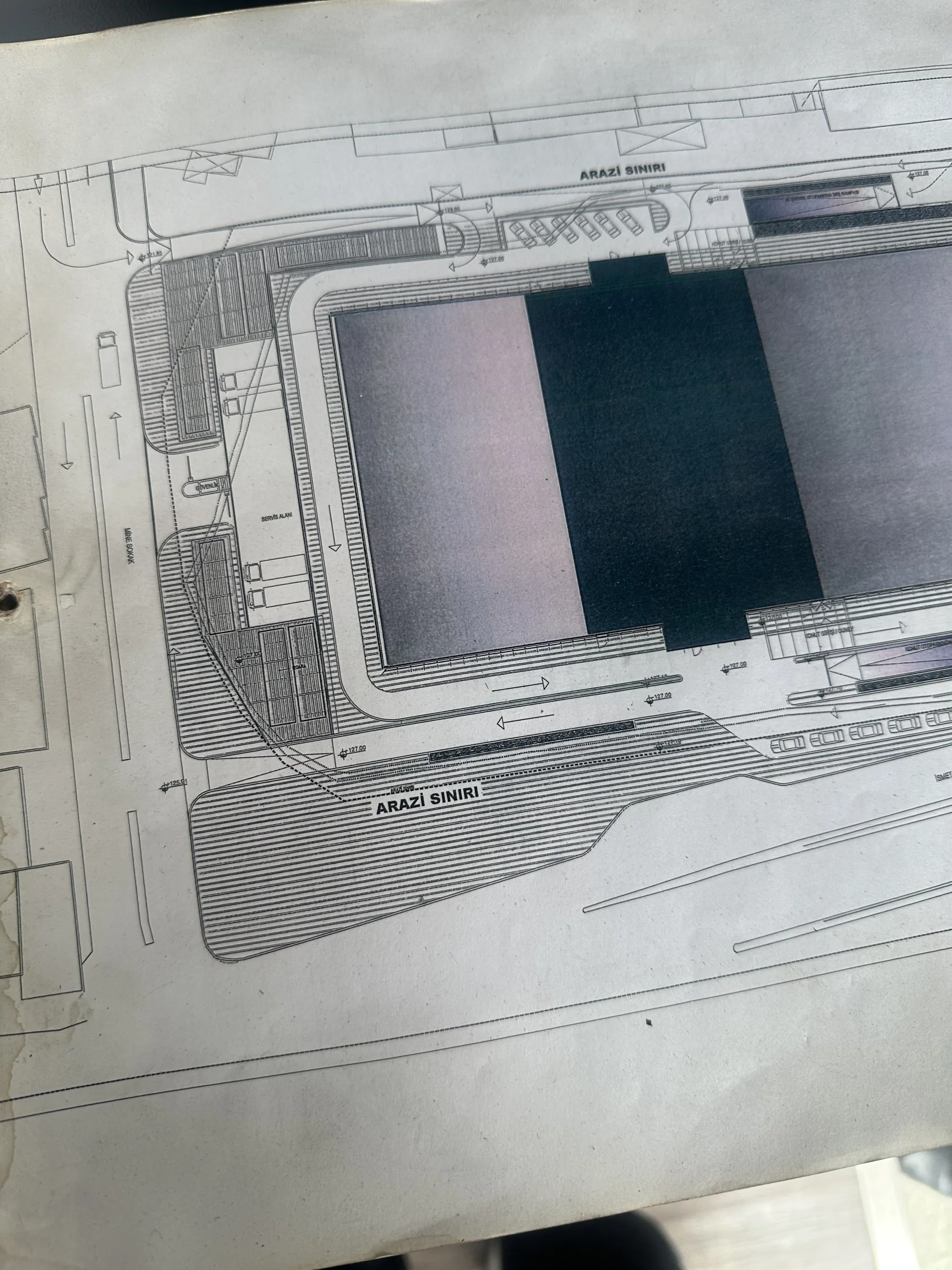 A printed site plan used during the design process