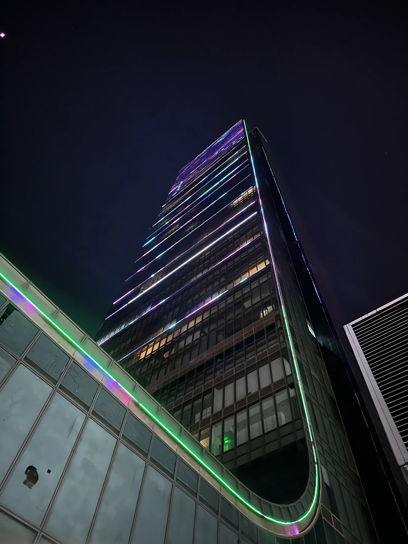 Istanbul Sapphire rising above the residence entrance at night