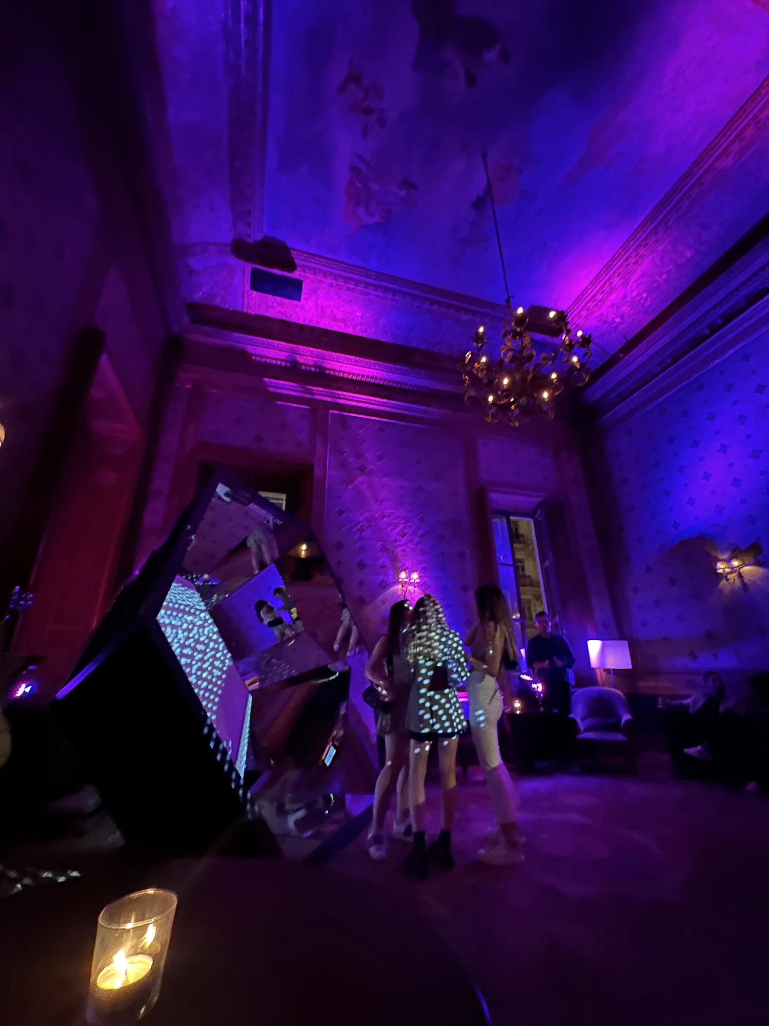 Visitors and violet light at the Soho House Back to School Party