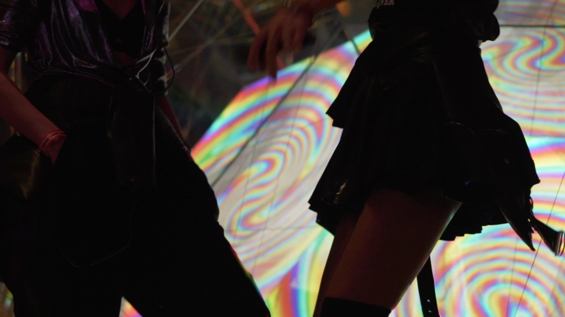 Visitors and colourful projections reflected in Space at Sónar