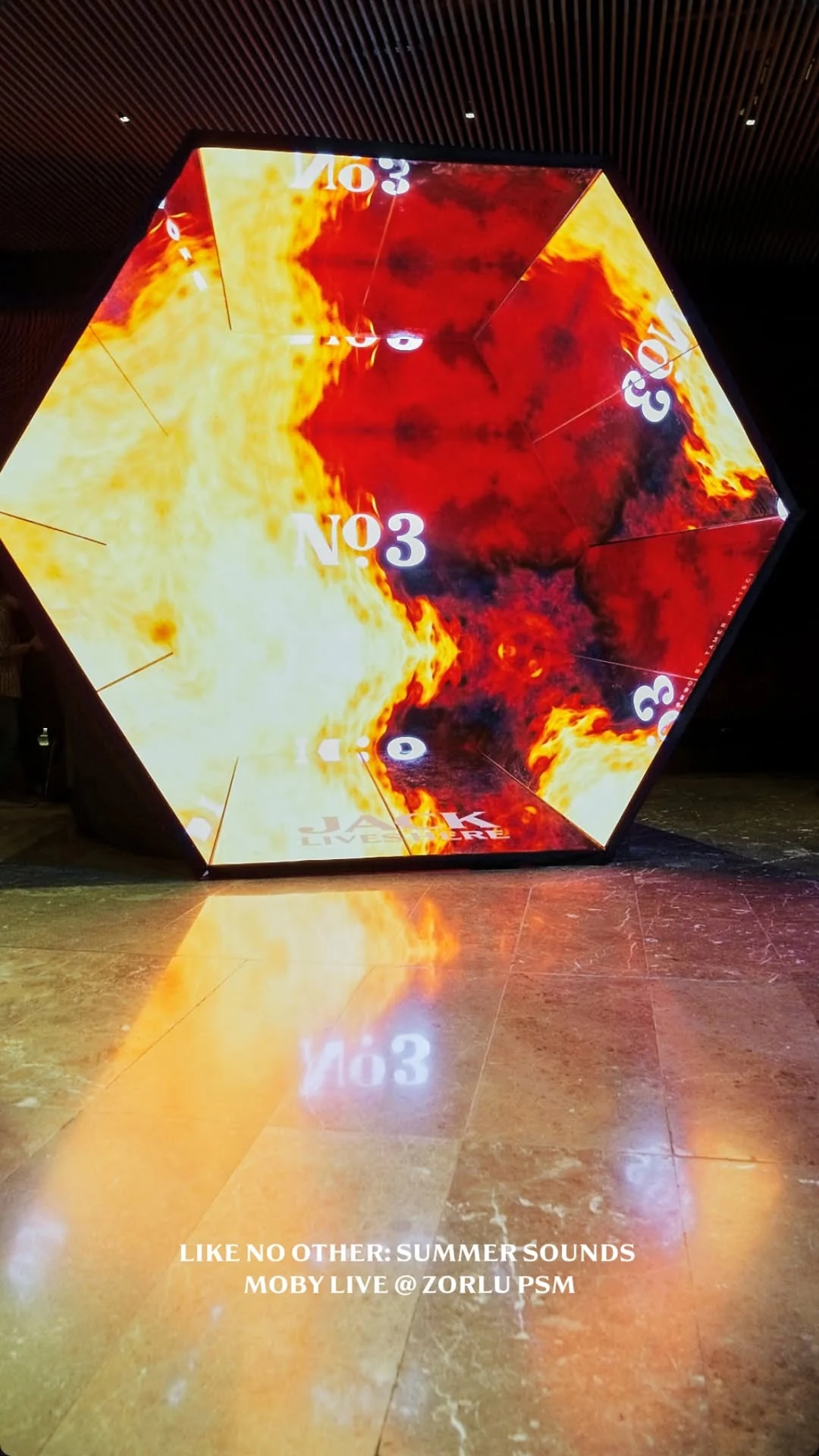 Space Giga illuminated with warm projections at a Jack Lives Here event