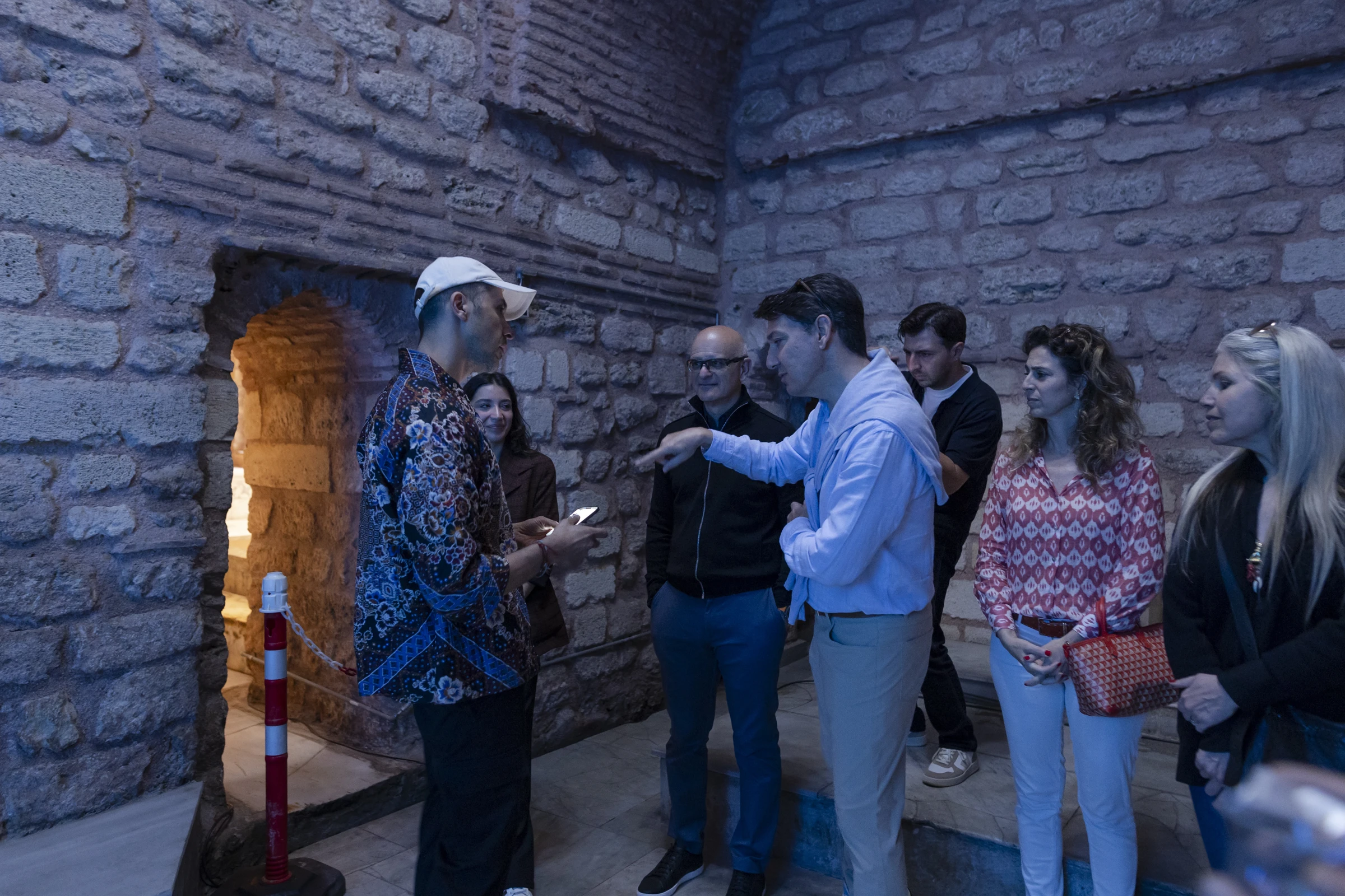 Tamer in conversation with visitors inside the Hamam