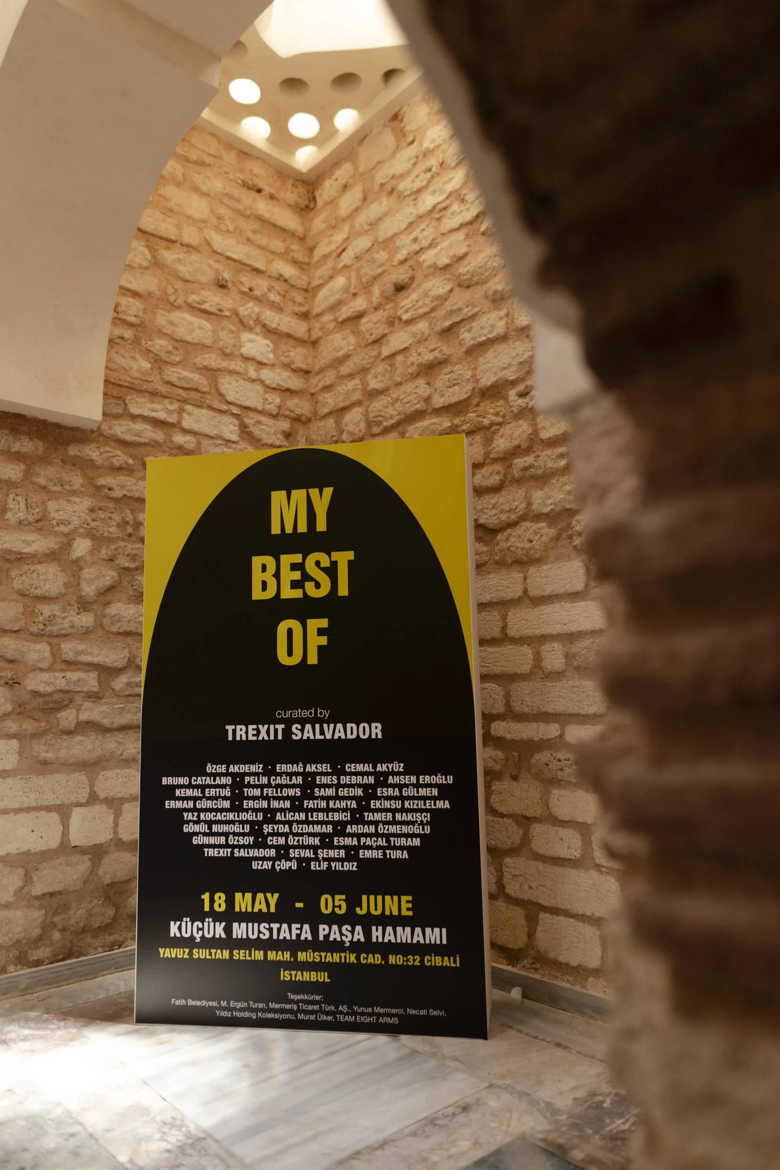 The My Best Of exhibition poster beneath the Hamam’s vaulted entrance