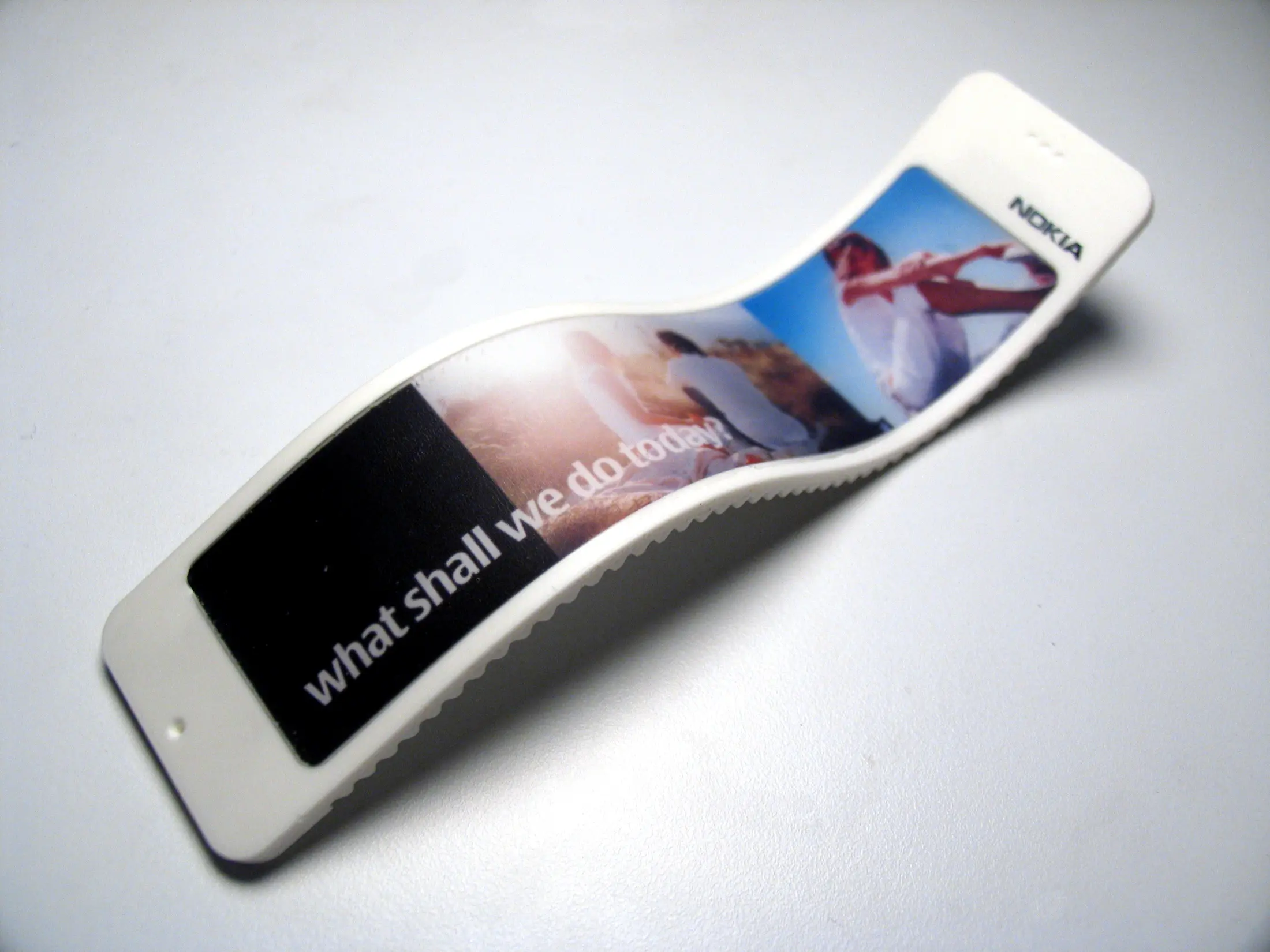 White Nokia 888 model opened into a flowing screen form
