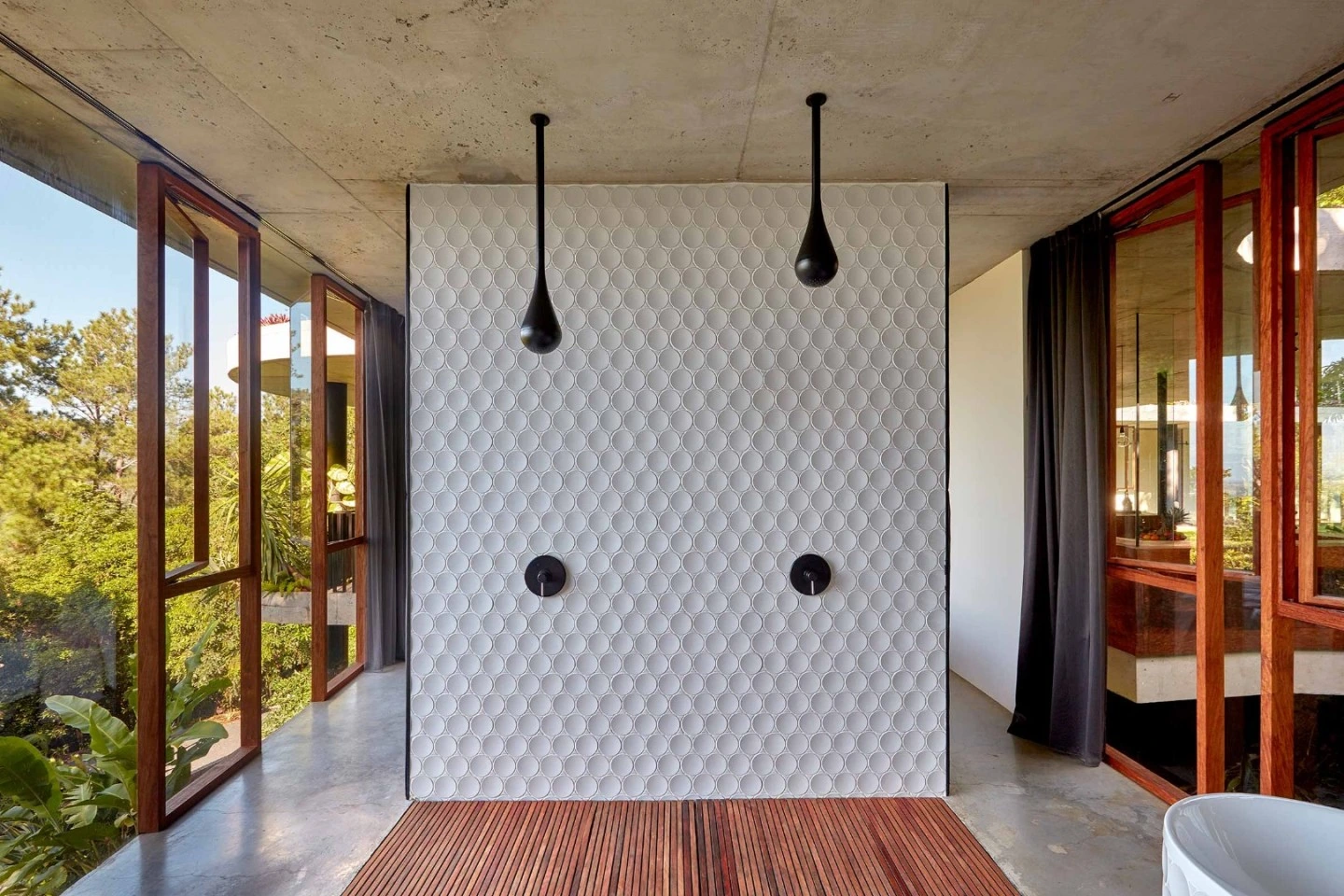 Dot wall across the bathroom under pendant lights